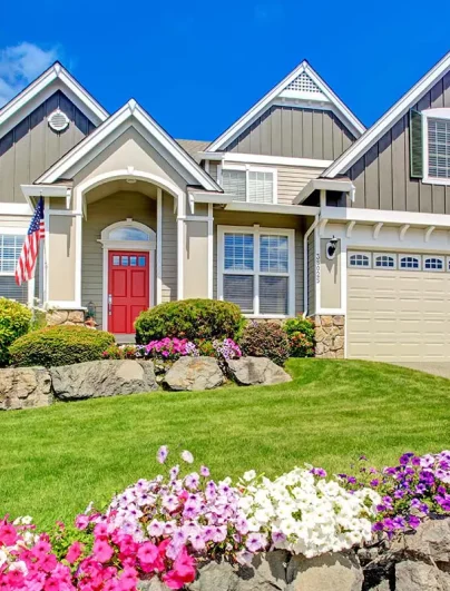 Home-Insurance-Family-Home-with-a-Red-Door-and-American-Flag-Outside Home-Insurance-Family-Home-with-a-Red-Door-and-American-Flag-Outside